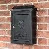 Deluxe Black "Tudor Rose” Wall Mounted Post Box -Garden Supply Discount Store black slimline modern letter box with tudor rose motif