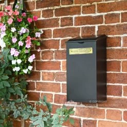 Medium "Pevensey Square” Newspaper And Parcel Holder -Garden Supply Discount Store black wall mounted parcel box on brick wall