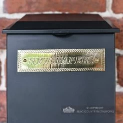 Standard "Pevensey Square” Newspaper And Parcel Holder -Garden Supply Discount Store brass newspapers plaque on black parcel box