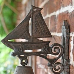 Rustic Garden Bell - Sailboat -Garden Supply Discount Store rustic iron sailboat garden bell close up